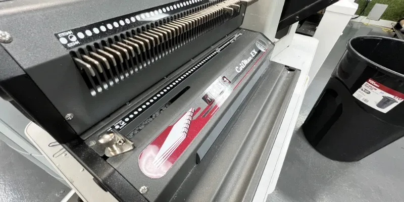 A spiral binding machine used in finishing booklets.