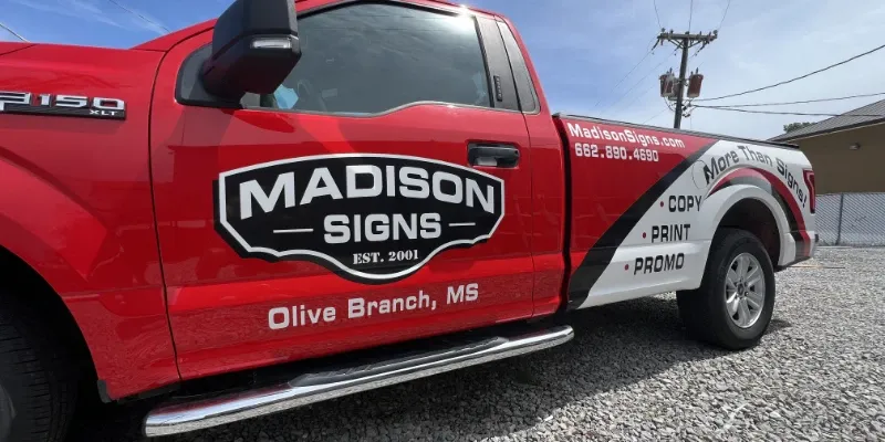 Truck with vinyl lettering and decals.